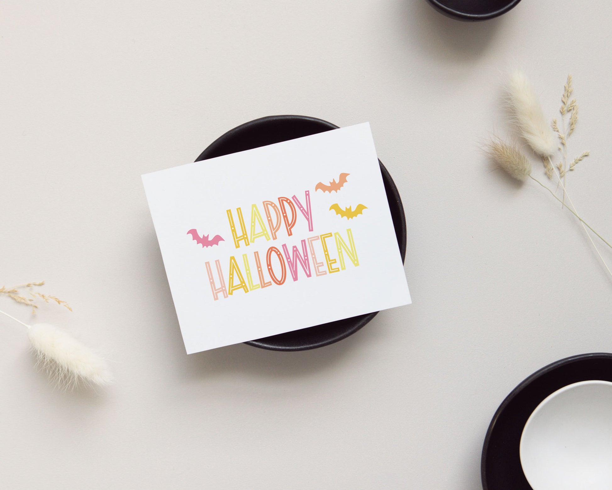 preppy happy halloween greeting card, yellow orange and pink color palette, friendly bats