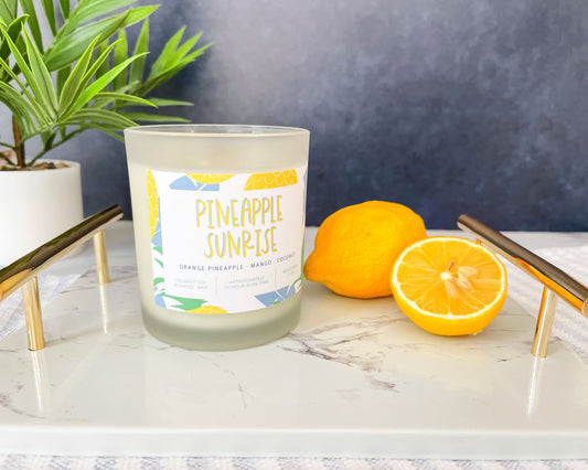 pineapple sunrise candle, orange pineapple mango coconut scent, frosted glass container, soy wax candle, meredith collie paper